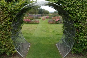 STAINLESS STEEL MOON ARCHWAY IN BEECH HEDGE WORCESTERSHIRE